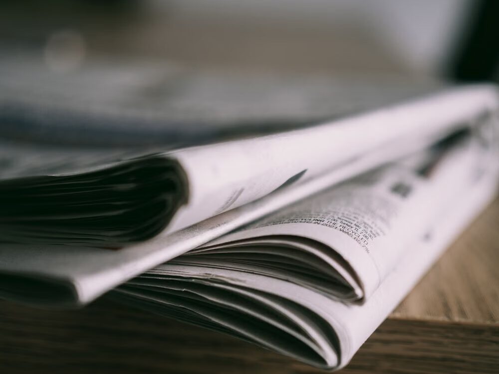 Journalist verifying information before submitting updates to a newsroom.